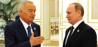 Poetin en Karimov staan samen op een officile foto.